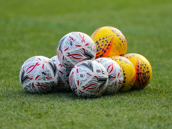 General view of footballs on a pitch