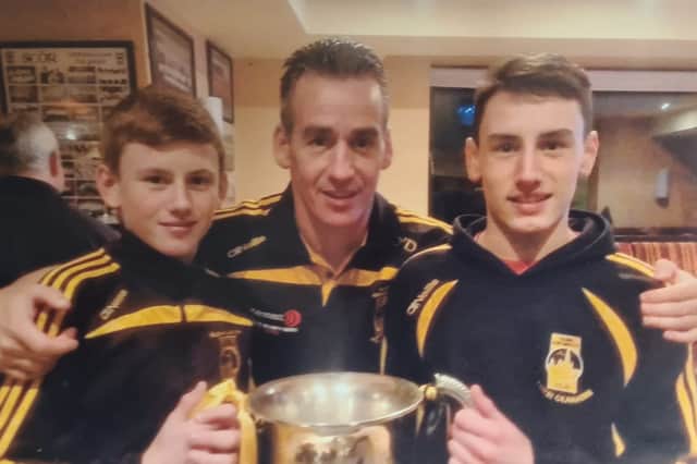 Conor, Ciaran and David O'Donnell with the Dr Maguire Cup