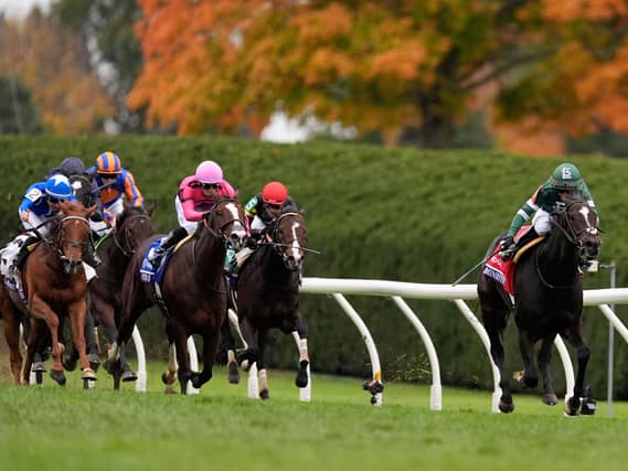 Kendrick Carmouche rides Deterministic, right, in the Breeders’ Cup Mile