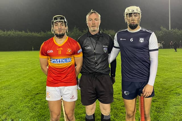 Captains Mark Downey and Patrick O’Callaghan with referee Sean Higgins