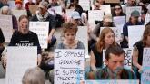 Protesters defy police warnings with signs supporting Palestine Action