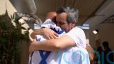 In Pictures: Israeli hostages and Palestinian prisoners are welcomed home