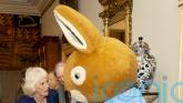 Queen meets Peter Rabbit as she wishes reading charity ‘happy 100th birthday’