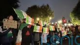 Protesters let off pink smoke during asylum demonstration at Citywest