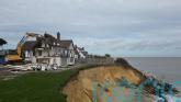 Demolition of clifftop home threatened by coastal erosion under way