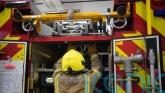 Road closed as firefighters tackle house fire