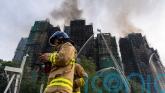 Firefighters continue to tackle deadly Hong Kong tower blaze