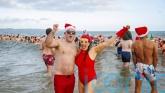 Hundreds brave the cold to make a splash for charity