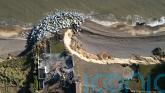 Aerial images show demolition of fourth clifftop home amid coastal erosion