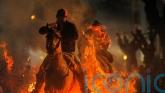 Horses leap through flames and pets blessed in honour of patron saint of animals