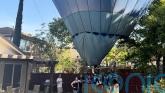 Mind if we drop in? Hot air balloon makes emergency landing in back garden