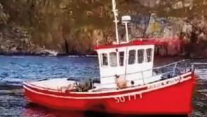 Fisherman may have been trapped in boat before drowning
