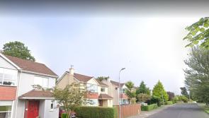 Woman arrives home to find intruder standing on her stairs