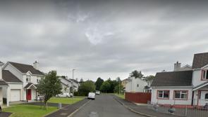 Four inch cement block thrown through window of woman living alone