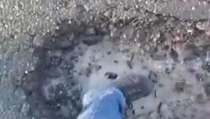 Watch: 20cm deep pothole damages car in Laois 