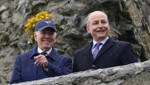 US president cheered by well-wishers waiting in the rain in Carlingford