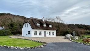 PICTURES: Unusual thatched Clare house in famous spot with sea views on sale for €475,000
