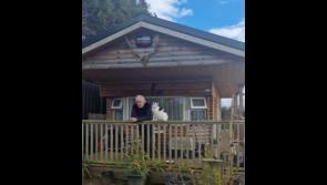 Hearing for man living in log cabin pushed to later date