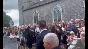 WATCH: Poignant moment at Harry Gleeson's burial as his fiddle is used to lay him to rest