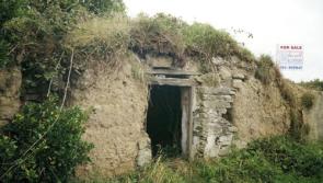 One of the last remaining mud houses in Clare being surveyed by an archaeologist