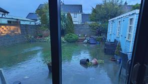 PHOTOS: Cllr Nash helps unblock drains as Bay Estate in Dundalk remains flooded