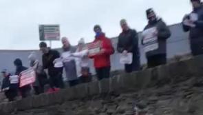 Watch: Mica redress campaigners  face Taoiseach Micheál Martin at Derry event