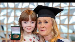 Two Clare graduates celebrate after receiving top awards