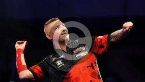 Nathan Aspinall wins after playing through the pain at Alexandra Palace