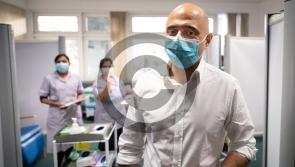 Covid infections soar to record high as Omicron sweeps through UK