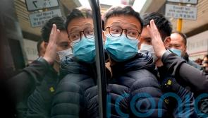Hong Kong police arrest six people and raid pro-democracy news outlet