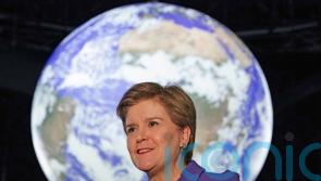 Nicola Sturgeon and Alister Jack both look forward to better times in 2022