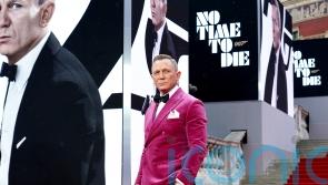 Craig’s Bond exit, Indy and Tom Cruise: The showbiz year in pictures