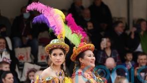 Dancers and bike stunt teams perform at scaled-down return of new year parade