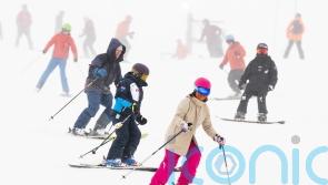 Skiers back on the slopes as resorts open after snowfall