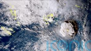 Islanders rush to escape waves after undersea volcano erupts near Tonga