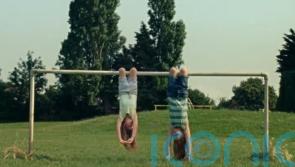Dairylea ad banned over two girls eating while hanging upside down