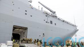 Australian navy ship with Covid-infected crew offloads aid to Tonga