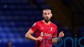 Liverpool defender Nat Phillips being chased by two Premier League clubs