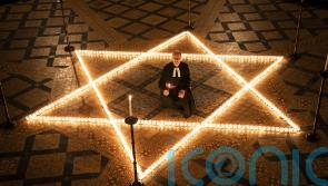 600 candles lit to remember victims of the Holocaust and other genocides