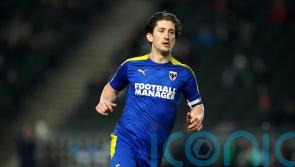 AFC Wimbledon waiting on Alex Woodyard ahead of Shrewsbury clash
