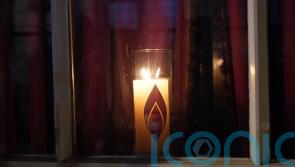 Survivors light candles in London to mark Holocaust Memorial Day