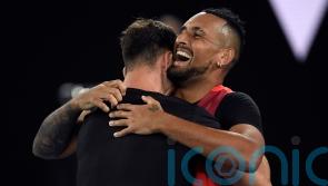 Nick Kyrgios lands first grand slam title by winning men’s doubles in Melbourne