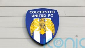 Emyr Huws scores last-gasp goal as nine-man Colchester hold Swindon