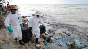 Favourable weather and clean-up keep oil slick away from Thai resort island