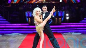 Debbie McGee shows off flexibility by doing splits live on Good Morning Britain