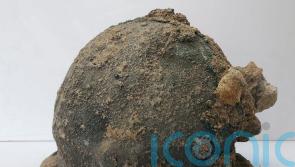 Ancient helmets found alongside temple ruins during dig in Italy