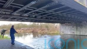 Magnet fisherman hoists dozens of small explosive devices from canal