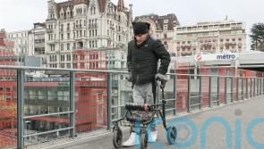 Paralysed men stand, walk and swim again thanks to new implant