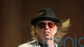 Neil Young urges Spotify employees to leave company ‘before it eats your soul’