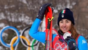 Italy’s Sofia Goggia battles through pain barrier to claim downhill silver
